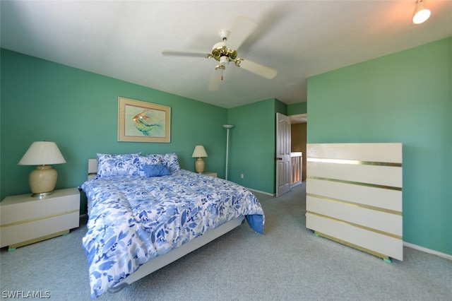 bedroom with ceiling fan and light carpet