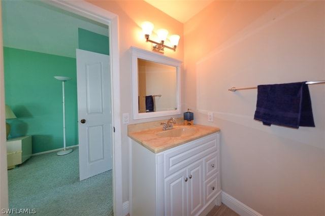 bathroom with baseboards and vanity