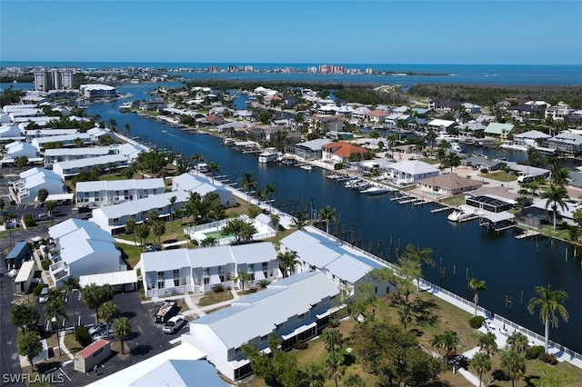 birds eye view of property featuring a water view and a residential view