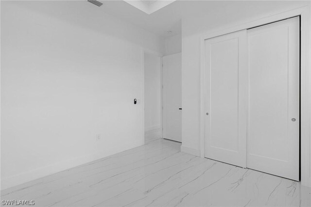 unfurnished bedroom featuring a closet