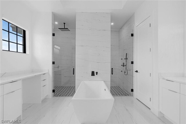 bathroom featuring separate shower and tub