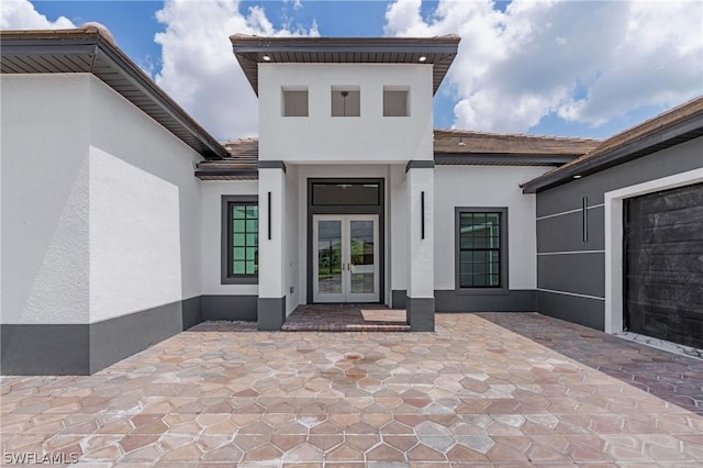 property entrance featuring french doors