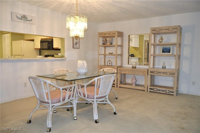 carpeted dining space with a notable chandelier and a textured ceiling