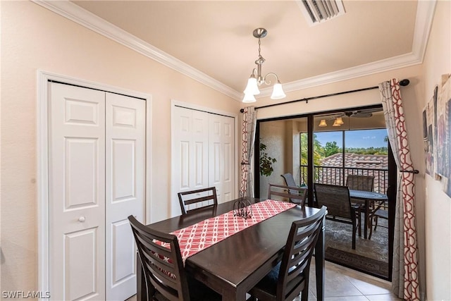 dining area with crown molding, light tile patterned floors, and a notable chandelier