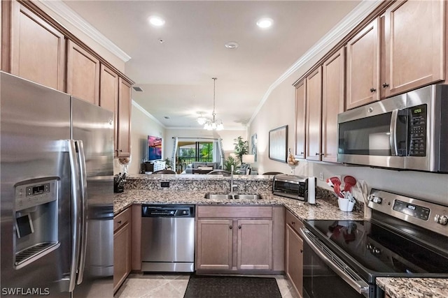 kitchen with sink, an inviting chandelier, ornamental molding, and appliances with stainless steel finishes