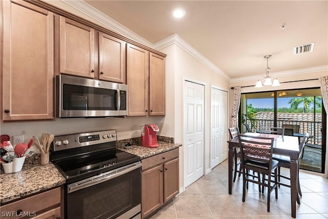 kitchen with light stone countertops, hanging light fixtures, stainless steel appliances, a notable chandelier, and ornamental molding