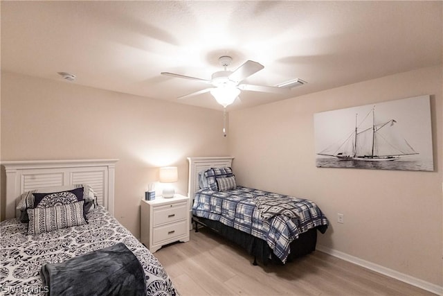 bedroom featuring ceiling fan and light hardwood / wood-style flooring