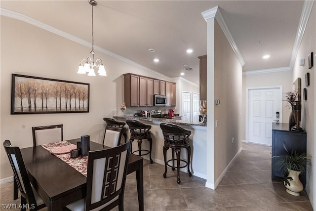 tiled dining area featuring a notable chandelier and crown molding