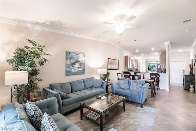 living room featuring ceiling fan, vaulted ceiling, and ornamental molding