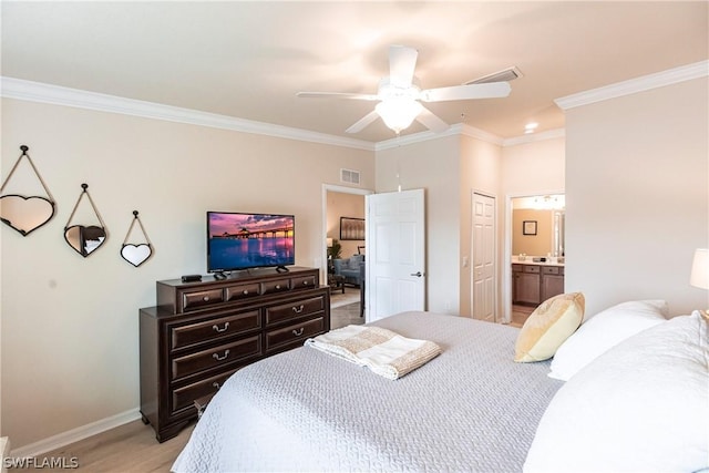 bedroom with ensuite bath, ceiling fan, light wood-type flooring, a closet, and ornamental molding