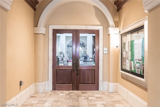 property entrance featuring french doors