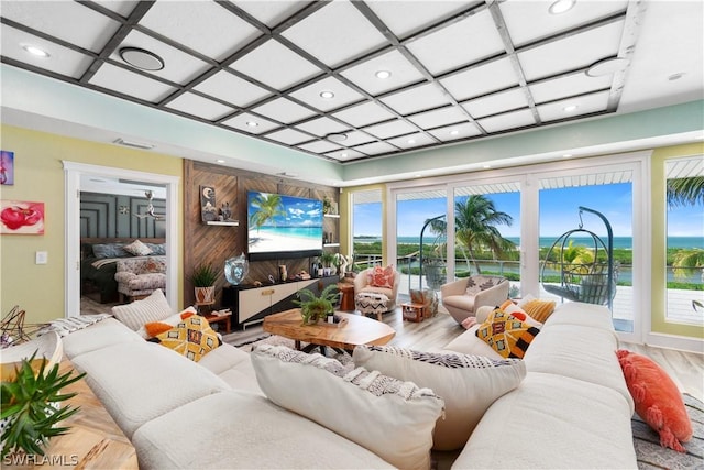 living room featuring hardwood / wood-style flooring and coffered ceiling