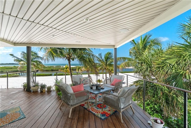 wooden deck featuring a water view