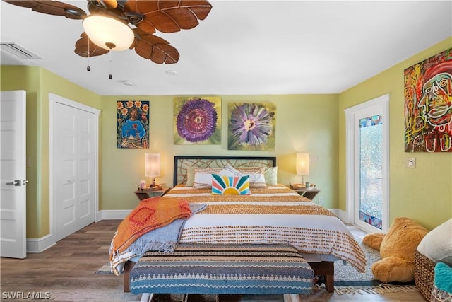 bedroom with hardwood / wood-style flooring and ceiling fan