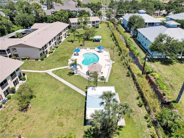 birds eye view of property with a residential view