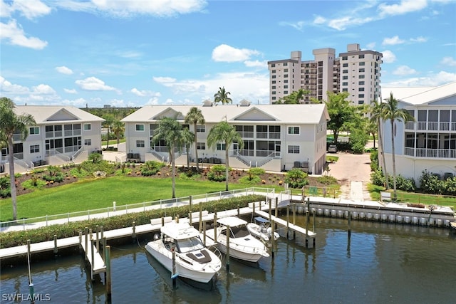 18080 San Carlos Blvd Unit 724, Fort Myers Beach, FL 33931 - view of dock with a lawn, a water view, and boat lift