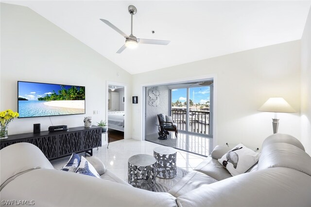 living room with hardwood / wood-style flooring, high vaulted ceiling, and ceiling fan