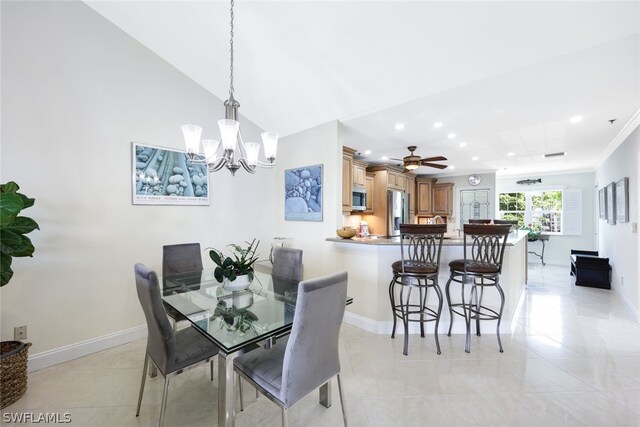 tiled dining room featuring crown molding and ceiling fan with notable chandelier