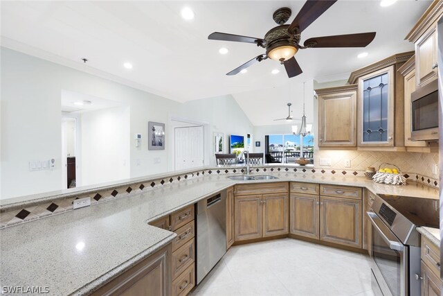 kitchen with tasteful backsplash, stainless steel appliances, sink, light tile patterned floors, and ceiling fan