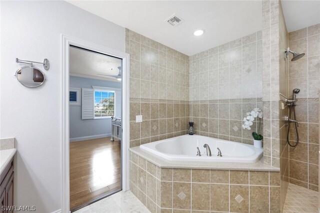 bathroom featuring vanity, shower with separate bathtub, and hardwood / wood-style flooring