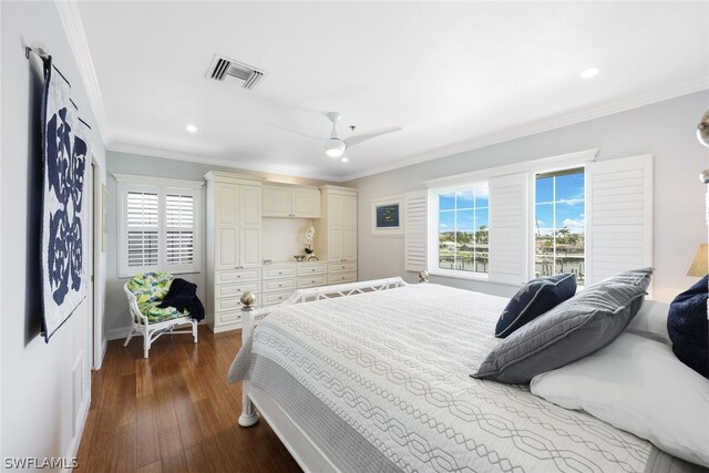 bedroom featuring ornamental molding, wood-type flooring, and ceiling fan