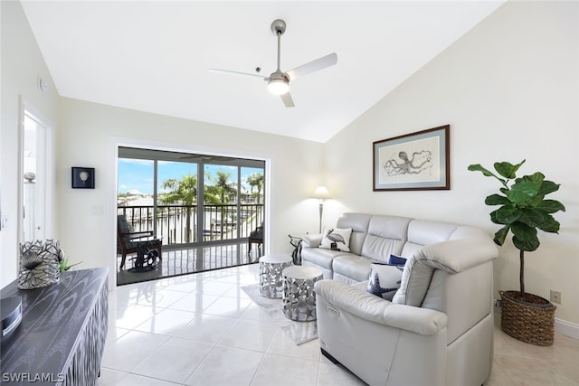 18080 San Carlos Blvd Unit 724, Fort Myers Beach, FL 33931 - living room featuring light tile patterned floors, a ceiling fan, and vaulted ceiling