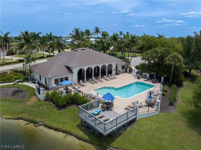 view of swimming pool with a lawn and a patio