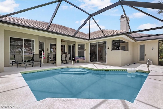 pool featuring a lanai and a patio