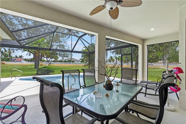 sunroom / solarium with ceiling fan