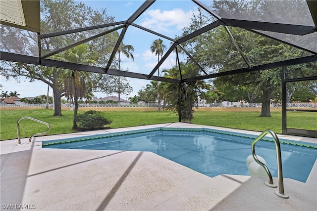 view of pool featuring a patio and a yard