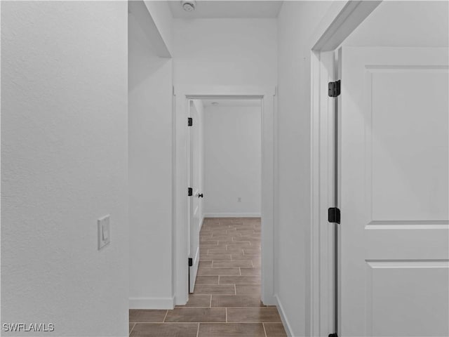 2917 NW 19th Ter, Cape Coral, FL 33993 - corridor with wood tiled floors and baseboards