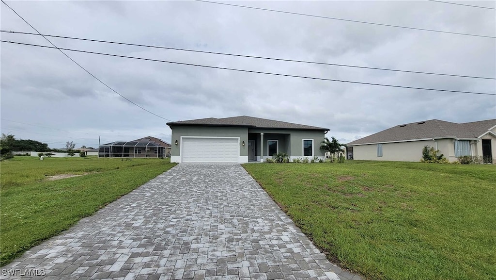 view of front of house featuring a garage and a front yard