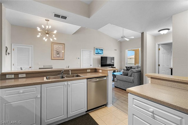 kitchen with dishwasher, ceiling fan with notable chandelier, sink, decorative light fixtures, and light tile patterned flooring