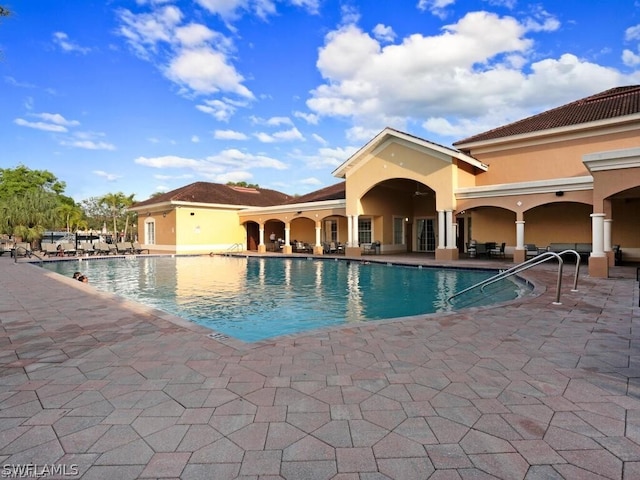 view of swimming pool with a patio