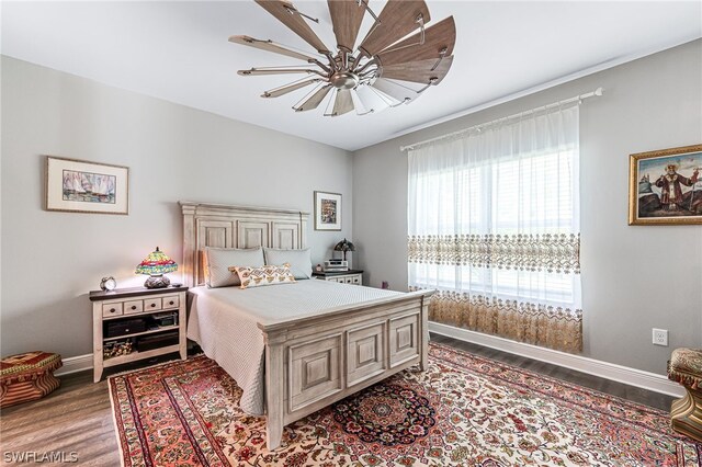 bedroom featuring ceiling fan and hardwood / wood-style flooring