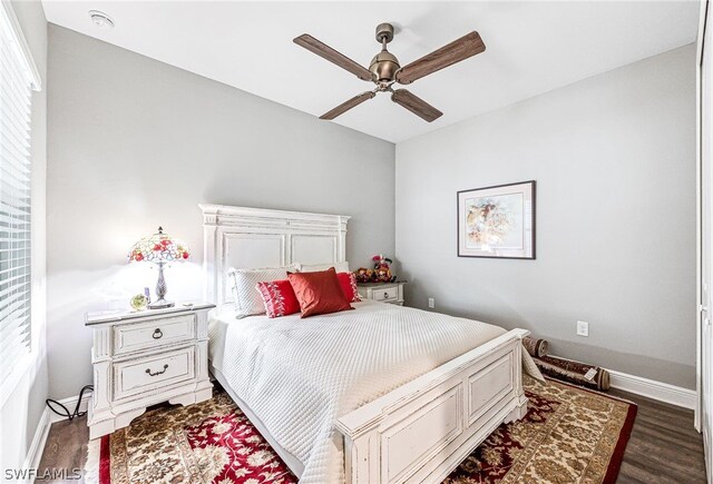 bedroom featuring ceiling fan and dark hardwood / wood-style floors