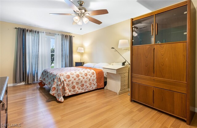 bedroom featuring ceiling fan and light hardwood / wood-style floors