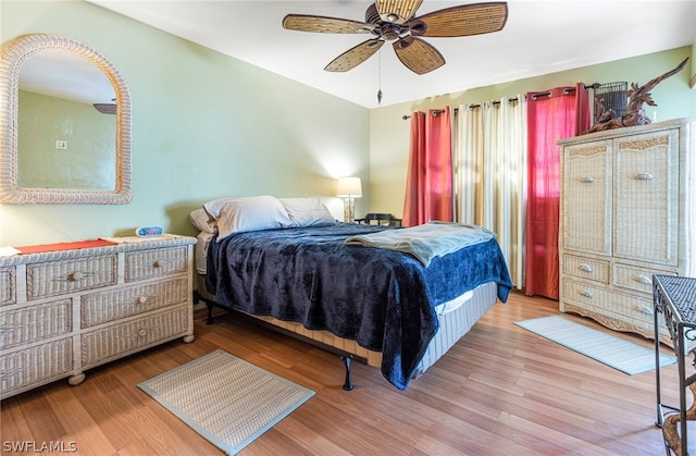 bedroom with ceiling fan and hardwood / wood-style floors