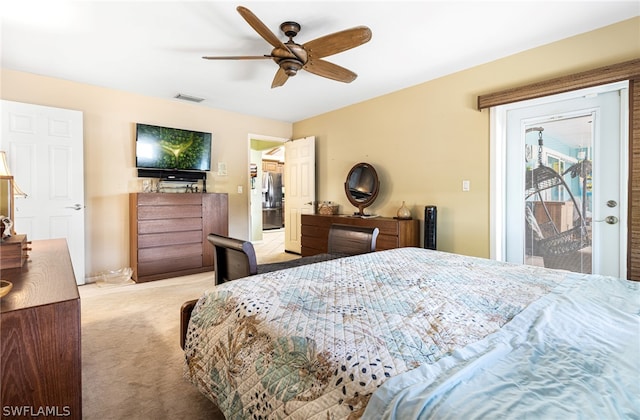 carpeted bedroom featuring ceiling fan, access to exterior, and stainless steel refrigerator with ice dispenser