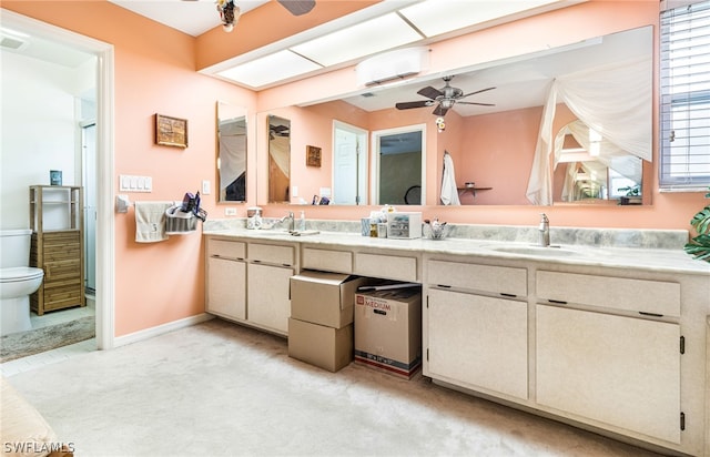 bathroom with ceiling fan, toilet, and vanity