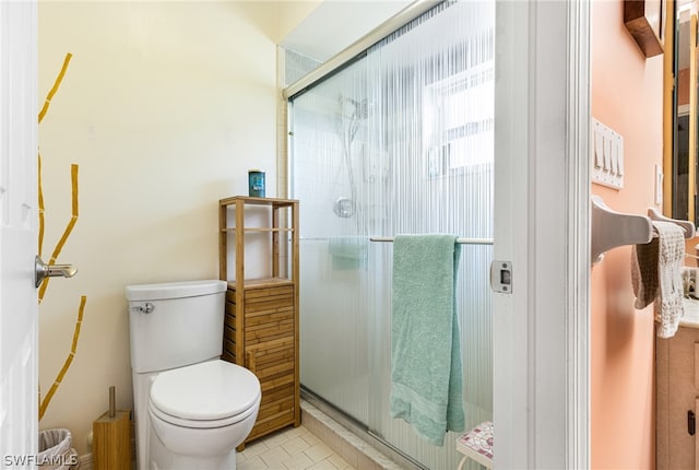 bathroom featuring toilet, walk in shower, and tile patterned flooring