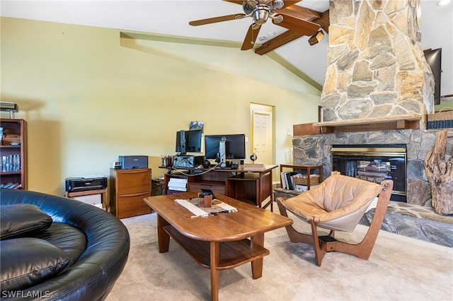 interior space featuring ceiling fan, a fireplace, and lofted ceiling with beams