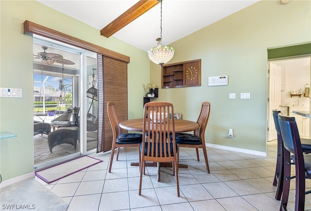 tiled dining space with ceiling fan and lofted ceiling with beams