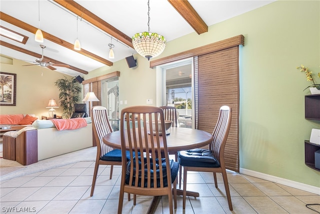 tiled dining room featuring ceiling fan and vaulted ceiling with beams