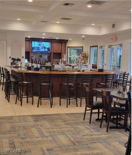 bar with light tile patterned floors