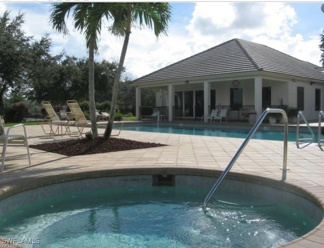 view of swimming pool featuring a patio area