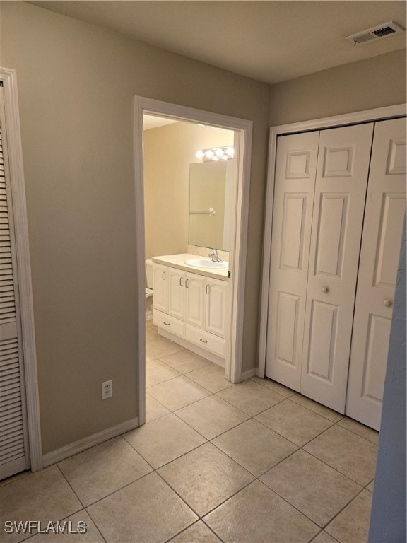 bathroom featuring vanity and tile patterned floors