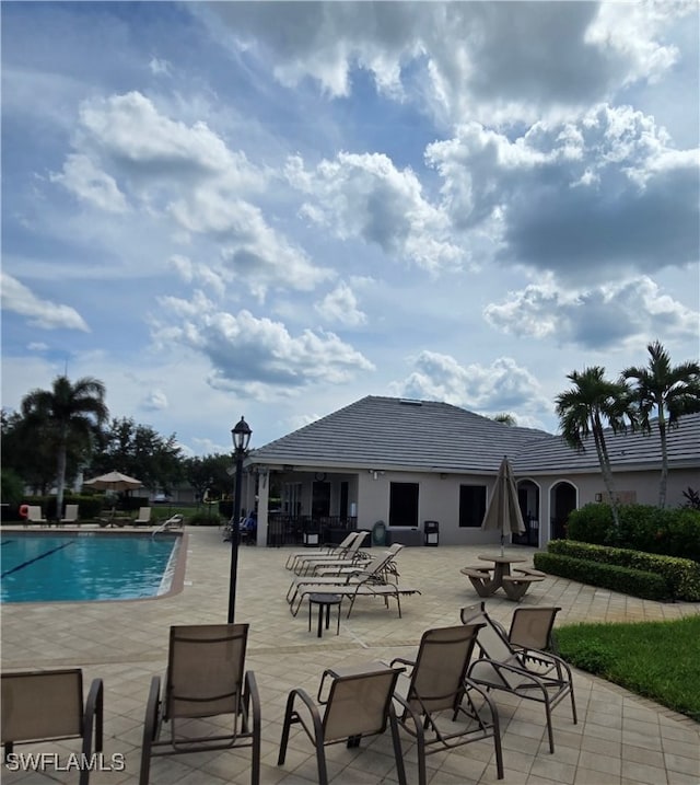 view of swimming pool with a patio