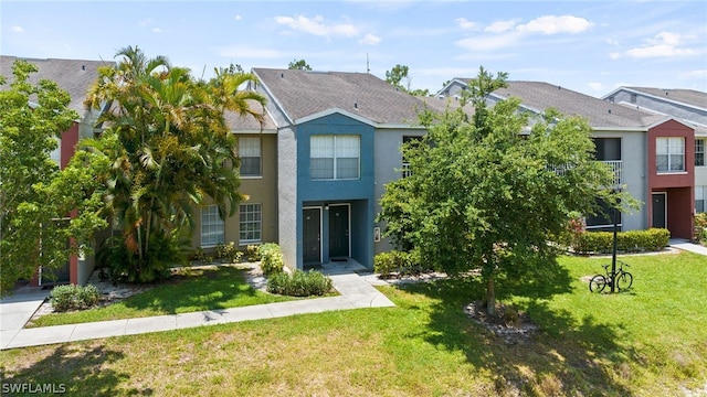 201 Santa Clara Dr Unit 13, Naples, FL 34104 - view of property featuring stucco siding and a front lawn