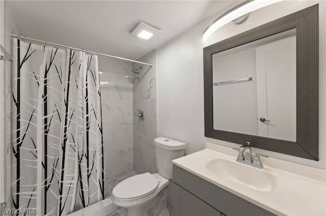 bathroom featuring vanity with extensive cabinet space, walk in shower, and toilet